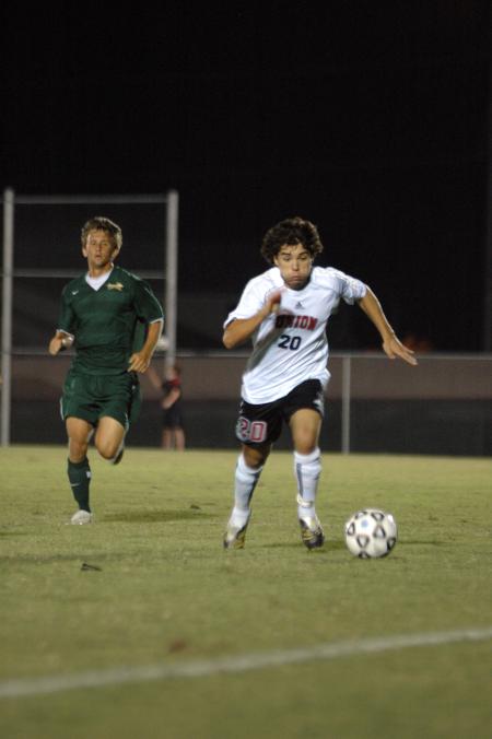 Freshman Edmundo Novarro chases down the ball before it rolls out of bounds. - Photo by Neisha Fuson