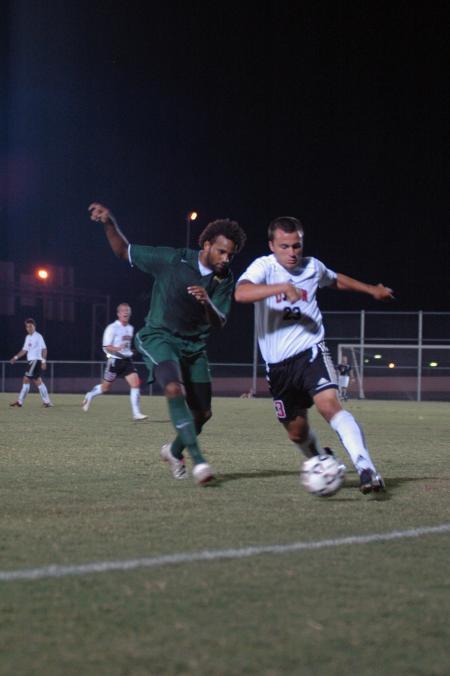 Freshman Franki Mocellin shields off the defender as he attempts to keep possession of the ball. - Photo by Neisha Fuson