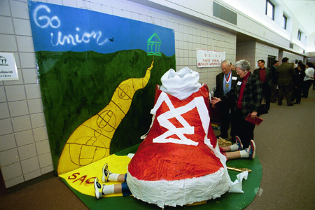 Alumni Marvin & Gene Fitts of Bartlett, Tenn. examine SAC's Homecoming 2003 display. - Photo by Jim Veneman