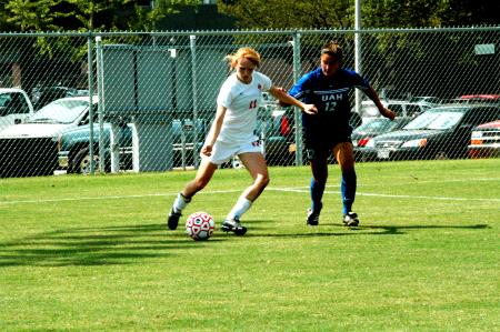 Sophomore Brooke Walker seeks to pass to a teammate streaking towards the center of the goal. - Photo by Matt Elia
