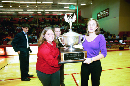 Junior Lisa Whiffen and Freshman Jennifer Winfield celebrate after they accept the Presidential Cup for Zeta Tau Alpha during Homecoming 2003.
 - Photo by Jim Veneman