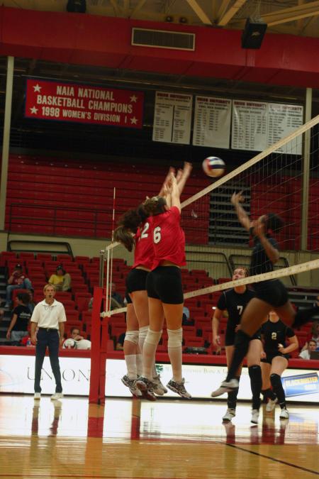 Union players go up for a block against Martin Methodist College (Tenn.). - Photo by Stephanie Schroeder