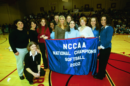 The Union softball team accepts their banner, which will be hung in the gym, as 2003 National Softball Championshiop winners. - Photo by Jim Veneman