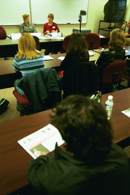 Alumni Hope Cooper and Bev Vos talk to future public relations professionals at the Communication Arts department's <i>Wisdom from the Trenches</i> during Homecoming 2003. - Photo by Justin Veneman