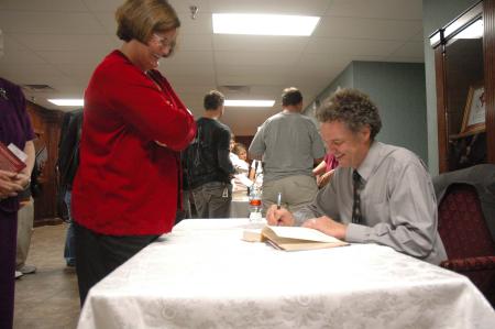 Dr. Edward L. Ayers signed books after speaking at the eleventh annual Carls-Schwerdfeger History Lecture Series.  - Photo by Neisha Fuson