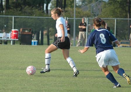 Emily Rawls handles the ball as Lambuth defenders approach.  Union gets the win 5-1. - Photo by Tommy Sadler