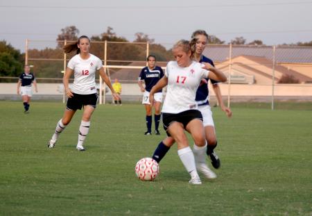Abigail Williams (17) tries to protect the ball from a Lambuth defender.  Union takes the match 5-1.
 - Photo by Tommy Sadler