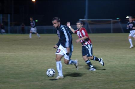 Freshman Franki Mocellin outruns his opponents downfield as he tries to jumpstart Union's offense in a match versus Martin Methodist. - Photo by Neisha Fuson