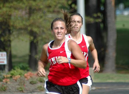 Candace Cross runs during the Union Cross Country Invitational.  Kayla Hauss follows close behind. - Photo by Tommy Sadler