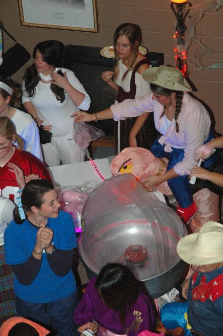 Hurt Complex RAs served up the cotton candy for students at this year's Costume Coffee House.  - Photo by Neisha Fuson