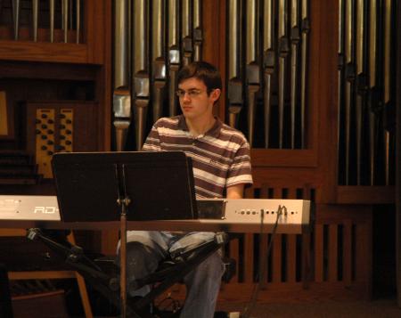 Micah Snow helped lead worship for a Homecoming chapel of singing praises and the reading of scripture.  - Photo by Neisha Fuson
