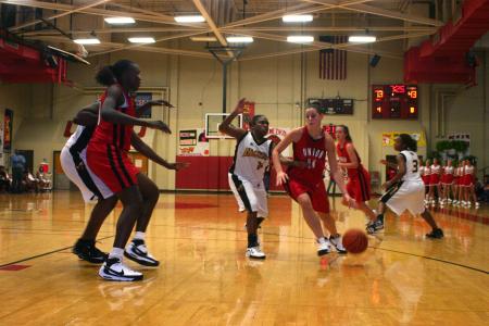 Sophomore Kaitlin Dudley drives past defenders from Harris-Stowe State College (Mo.) during the Lady Bulldog's Homecoming victory. - Photo by Stephanie Schroeder