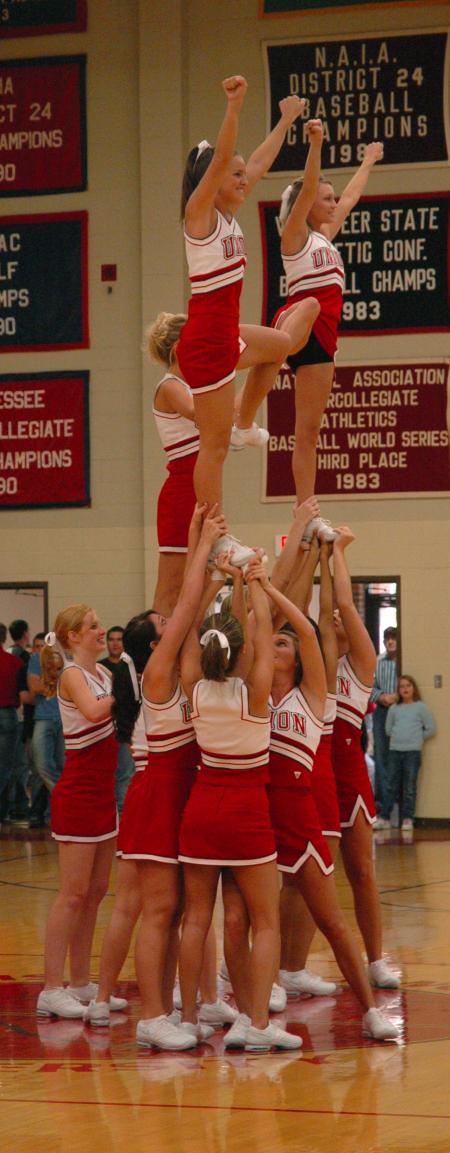 The Union cheerleaders form a stunt during the halftime show of the Homecoming game.  - Photo by Neisha Fuson