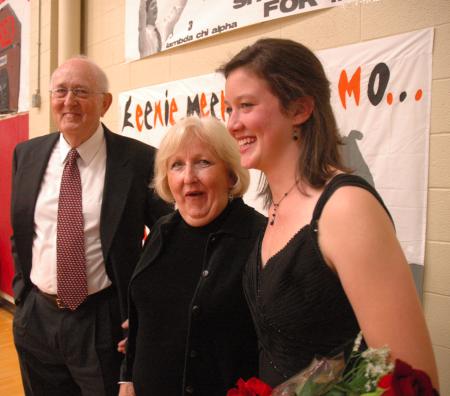 Sophomore Kelly Reed and her grandparents pose for some pictures during the Homecoming halftime.  - Photo by Neisha Fuson