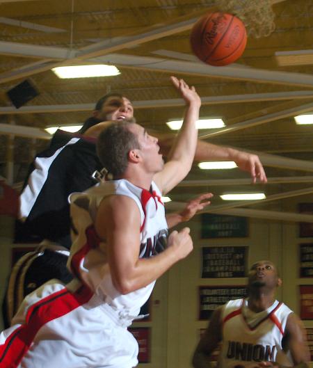 Union junior Matt Neaville tries to avoid the defender as he takes a shot during the Bulldogs Homecoming win over Campbellsville Univeristy (Ky.). - Photo by Matthew Diggs