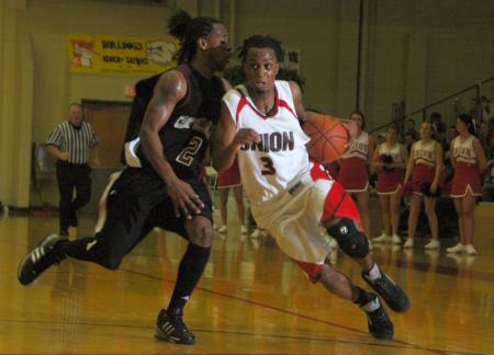 Sophomore guard Tacuma Alexander drives to the basket against a Campbellsville Univeristy (Ky.) defender in the Union's Homecoming victory. - Photo by Matthew Diggs