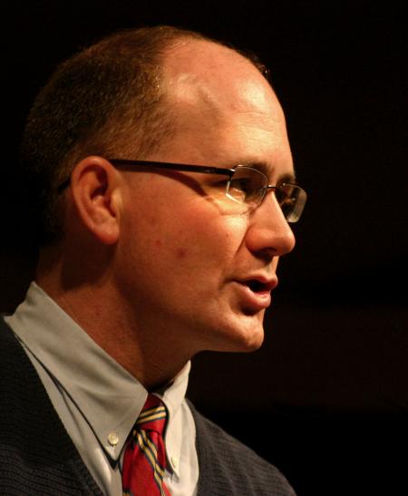 Brad Green, assistant professor of Christian studies, talks to students in chapel. - Photo by Stephanie Schroeder