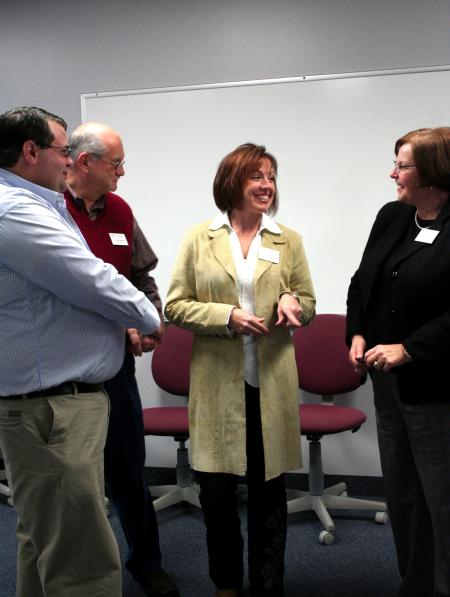 John Gross, Ken Newman, Michelle Atkins and Ann Singleton laugh and talk about what is going on in the School of Education. - Photo by Kristi McMurry Woody