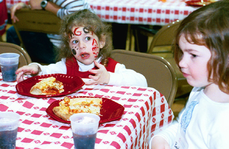 Union's Student Tennessee Education Association held Bulldog Camp again this year at Homecoming 2003.  Here a future Unionite enjoys some pizza. - Photo by Kristen Hiller