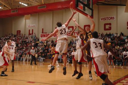 Freshman Antoine Joseph (23) lays the ball up in the net during a game against Freed Hardeman University.  - Photo by Neisha Fuson