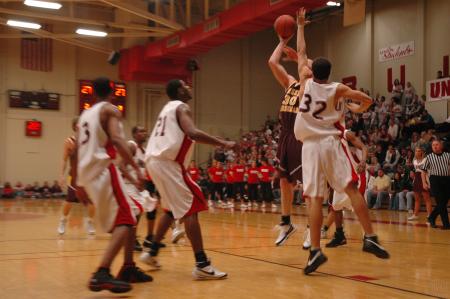 Freshman Veljko Petrovic (32) jumps to block a shot against Freed Hardeman.  - Photo by Neisha Fuson