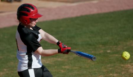 Softball catcher, Candice Thompson, makes a hit against Crichton College. - Photo by Kyle Kurlick
