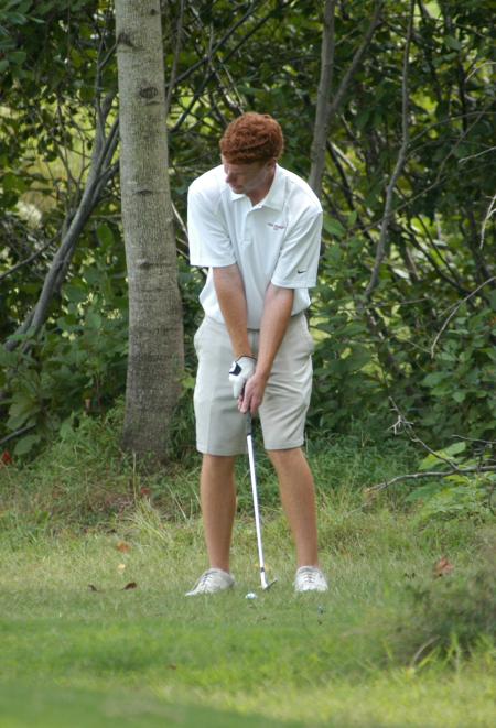 Tyler Lay chips from just off three green. - Photo by Steven Aldridge