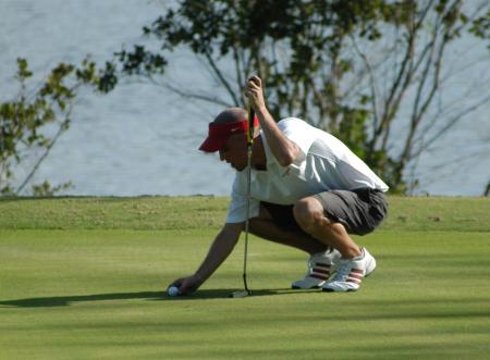 Mickey Armstrong places his ball on the marker as he gets set for his put. - Photo by Steven Aldridge
