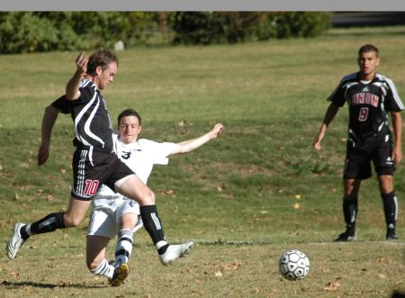 Benny Crozier tries to avoid a defender as he goes for the ball. - Photo by Steven Aldridge