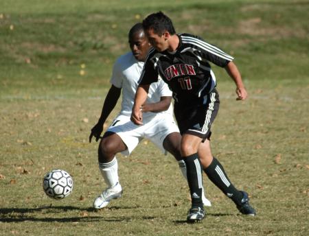 Kyle Sanders races to the ball ahead of a defender. - Photo by Steven Aldridge