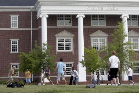Students enjoying May Day festivities by playing a pick-up game of soccer in front of White Hall. - Photo by Kyle Kurlick