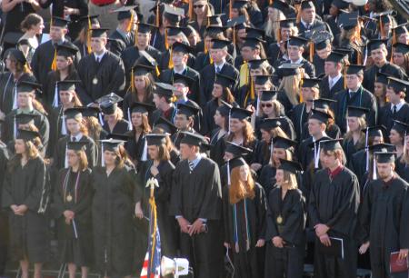 Students stand on the great lawn to receive their degrees. Dr. David S. Dockery, the university president, was the keynote speaker for the event, in which 400 students received degrees on the university’s Great Lawn. That brings to more than 950 the number of Union graduates from the class of 2008 – the largest class in Union’s history. - Photo by Morris Abernathy