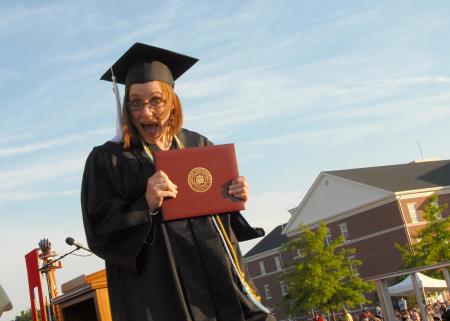 Jill Casey, senior class president, reacts with joy after she received her degree from Union University.
 - Photo by Morris Abernathy