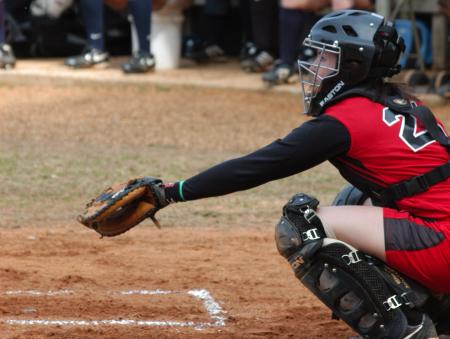 Lindsey Landreneau awaits a pitch from behind the plate. - Photo by Steven Aldridge