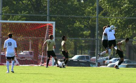 Darlan Rocha, freshman, fights for the ball during a game against Oklahoma Baptist.   - Photo by Kristi McMurry Woody