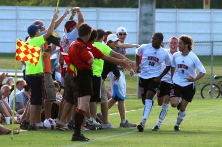 Bulldog fans congratulate the team on the goal scored during a game against Oklahoma Baptist University. - Photo by Kristi McMurry Woody
