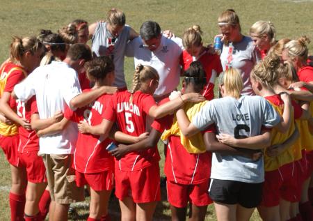 Head Coach Brandon Boylan leads his team in a pre-game prayer. - Photo by Steven Aldridge
