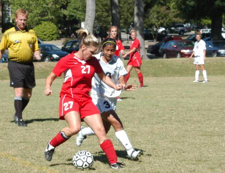 Katelin Dirksen moves the ball up the field against tight defense. - Photo by Steven Aldridge
