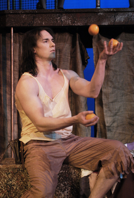Blake Staples as the clown Cockian in <i>Philemon</i>. - Photo by Jim Veneman