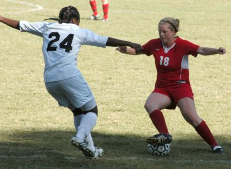 Candice Blackard uses her nifty footwork to keep ball possession against a Crichton player. - Photo by Steven Aldridge