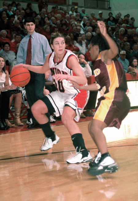 Junior Jessica Henson, guard, drives against a Freed-Hardeman University player at the TranSouth Conference tournament on Monday, March 10. Union defeated Freed-Hardeman 77-72, earning conference tournament honors. The NAIA tournament will be held March 19–25 at the Oman Arena in Jackson. - Photo by Justin Veneman