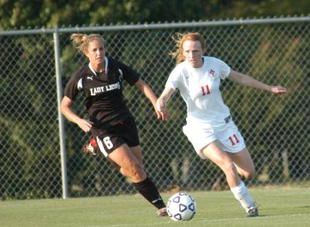 Brooke Walker attempts to keep the ball away from a Freed-Hardeman deefender in Union 1-0 win. - Photo by Tommy Sadler