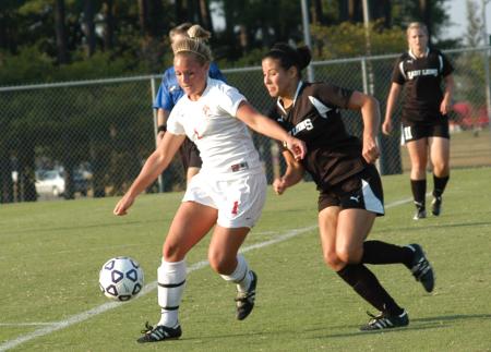 Caitlin Zimmerman works against a Freed-Hardeman defender as she controls the ball in Union's 1-0 win. - Photo by Tommy Sadler