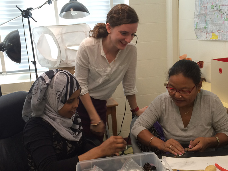 Sarah with Amal and Ran assembling necklaces for Ekata Designs.