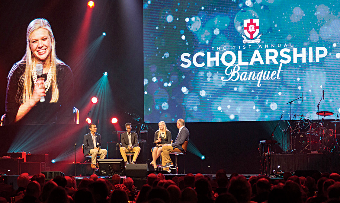 Oliver moderates a student panel — which includes Binh Morris (far left) — at the 2019 Scholarship Banquet