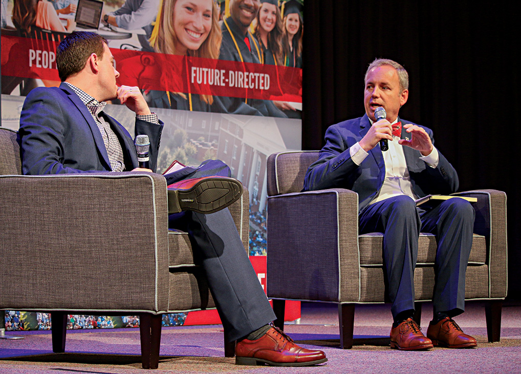 Chad Wilson, chairman of Union's Board of Trustees, talks with Oliver during chapel in March 2019.