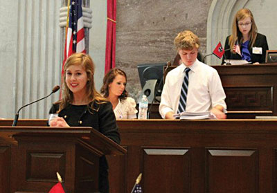 Union students Shelly Ezell (at podium) and Karl Magnuson (right) participate in the 42nd General Assembly of the Tennessee Intercollediate State Legislature