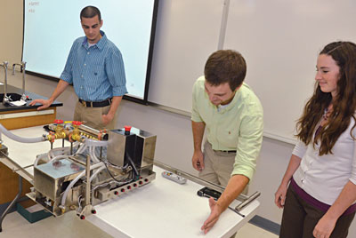 Aaron Porterfield, Jeff Maharrey and Rachel Quinn present their project