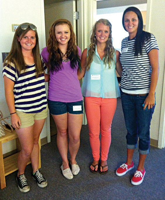 new students pose together on move-in day.