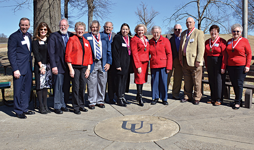 The Class of 1964 tours the Old Campus with the Olivers.
